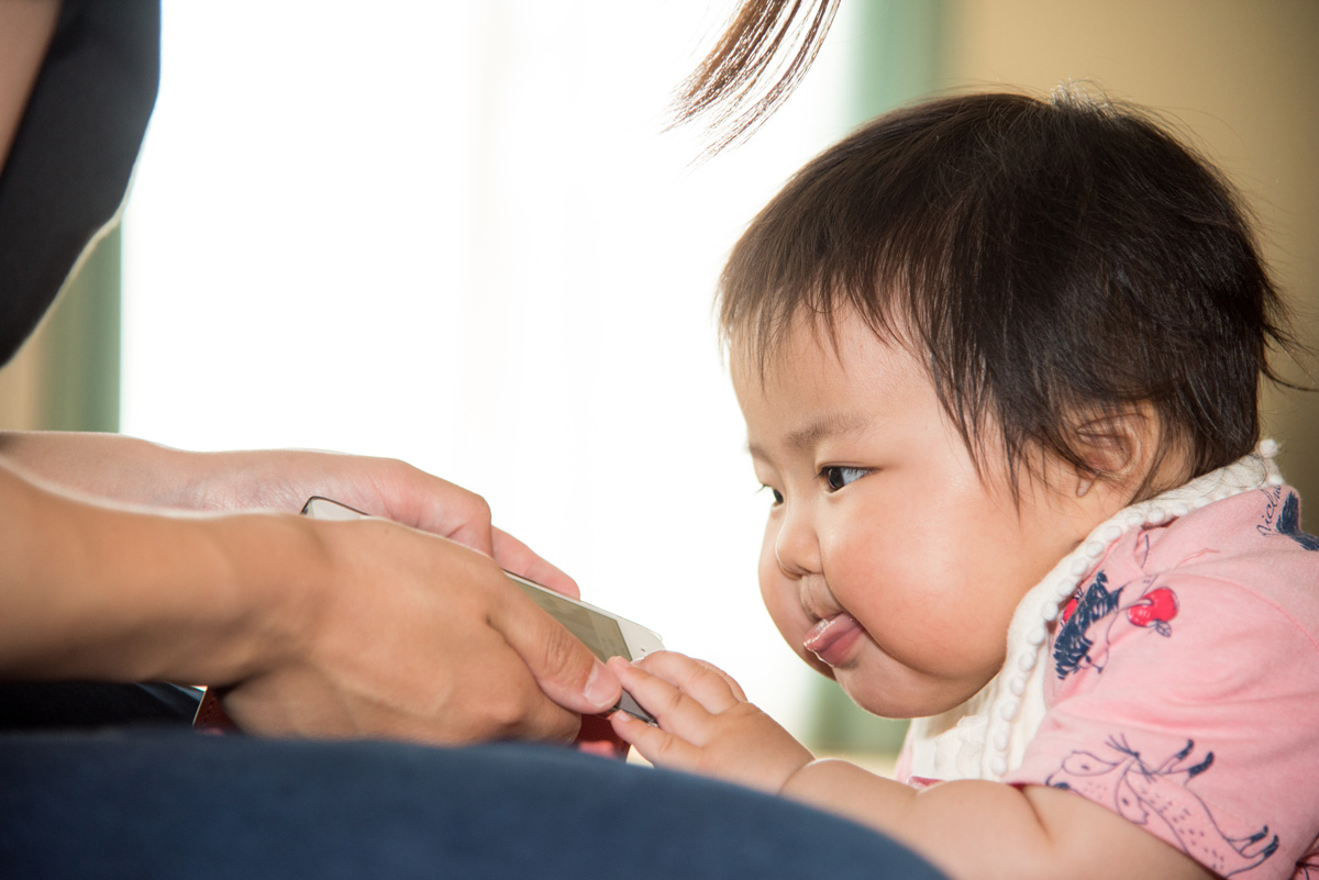 Baby Wanting to View Handheld Device